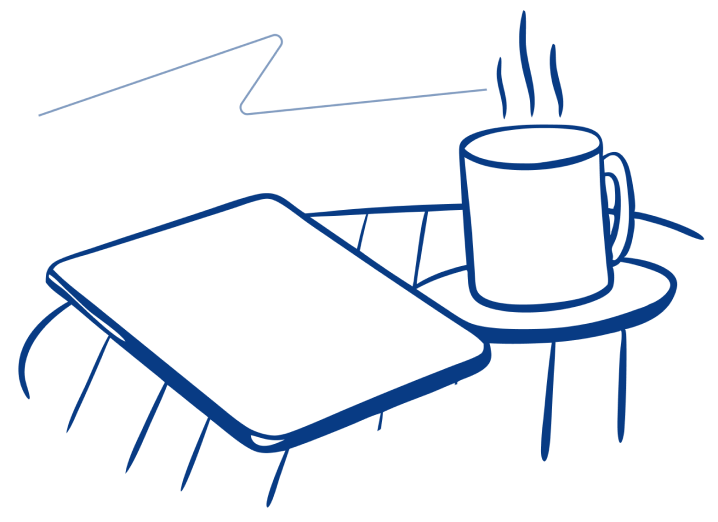 Coffee and tablet on a table